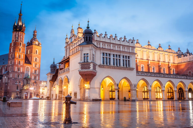 Center of Krakow, Old town The Main Market square view to Mariacki Cathedral and The Cloth Hall.