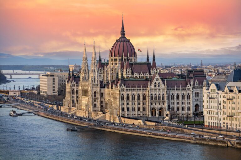 the hungarian parliament on the danube river at sunset in budapest hungary 945207010 5bf1ebcd46e0fb005866a0d4